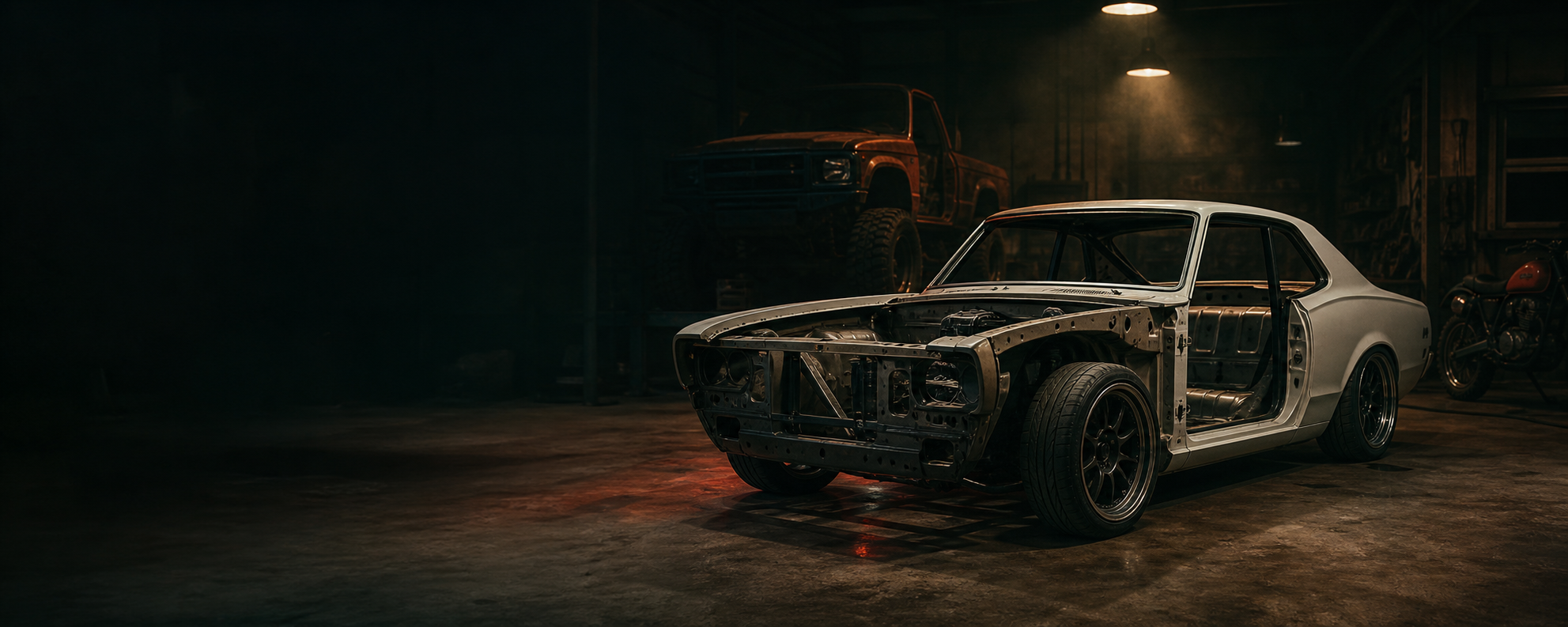 Unfinished project vehicles waiting inside a workshop